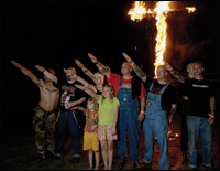 Racists salute a Burning Cross